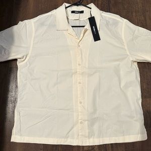 Off white, dress button up shirt. Size: L